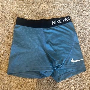 Blue and black Nike Pros